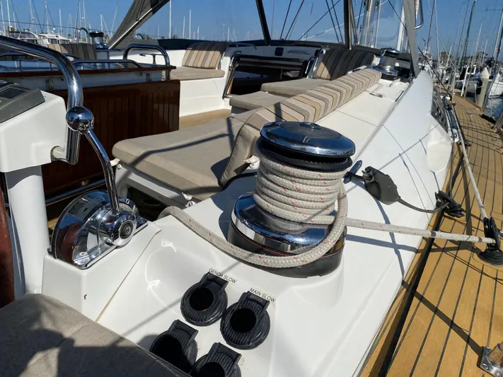  Yacht Photos Pics 2013 Jeanneau 57 sailboat deck with winch and seating area.