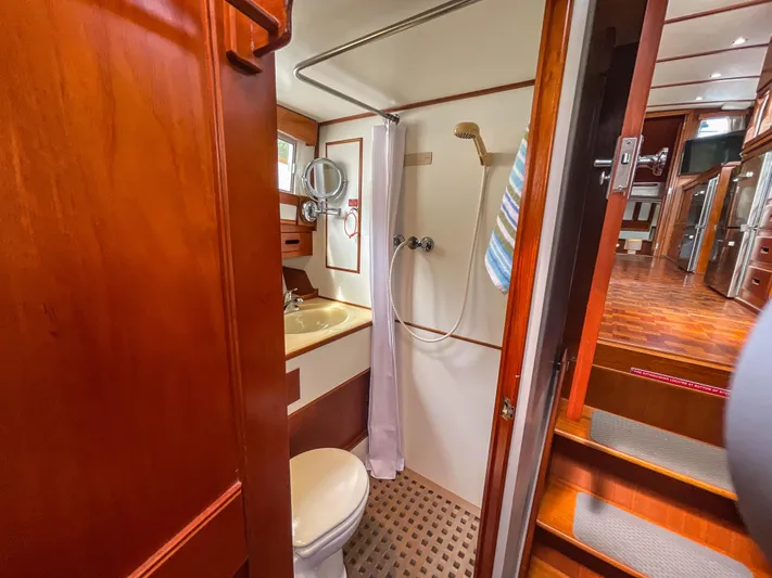 Tallulah Yacht Photos Pics 1989 Grand Banks 42 Classic yacht bathroom with wooden interior and shower area.