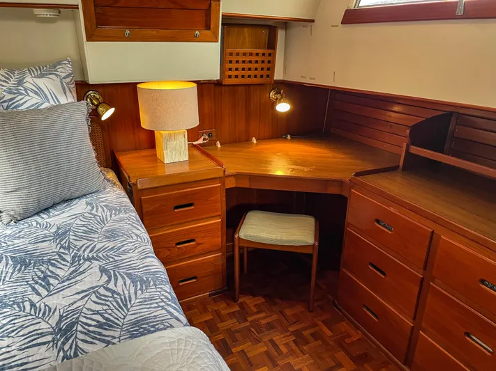 Tallulah Yacht Photos Pics Cozy cabin interior of 1989 Grand Banks 42 Classic with wooden desk and bed.