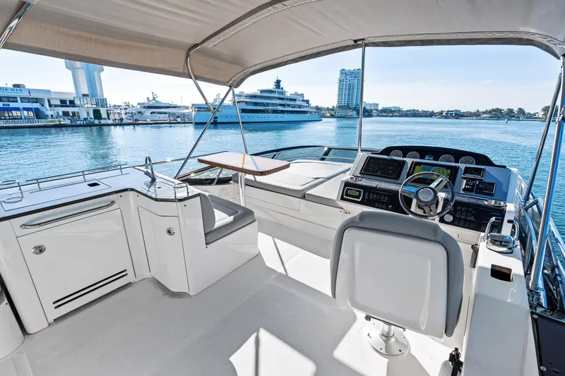 Guilty Pleasure Yacht Photos Pics 2014 Sea Ray 510 Flybridge yacht interior with helm, seating, and waterfront view.