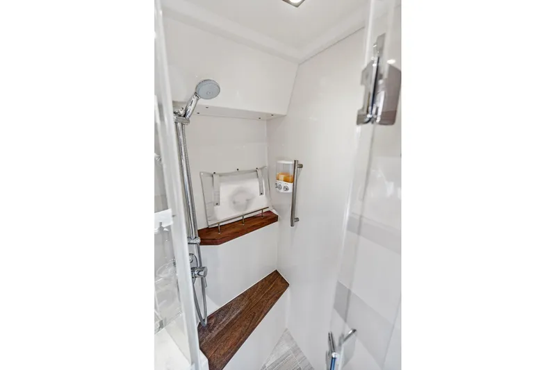 Guilty Pleasure Yacht Photos Pics Luxurious shower area in 2014 Sea Ray 510 Fly yacht with modern fixtures.