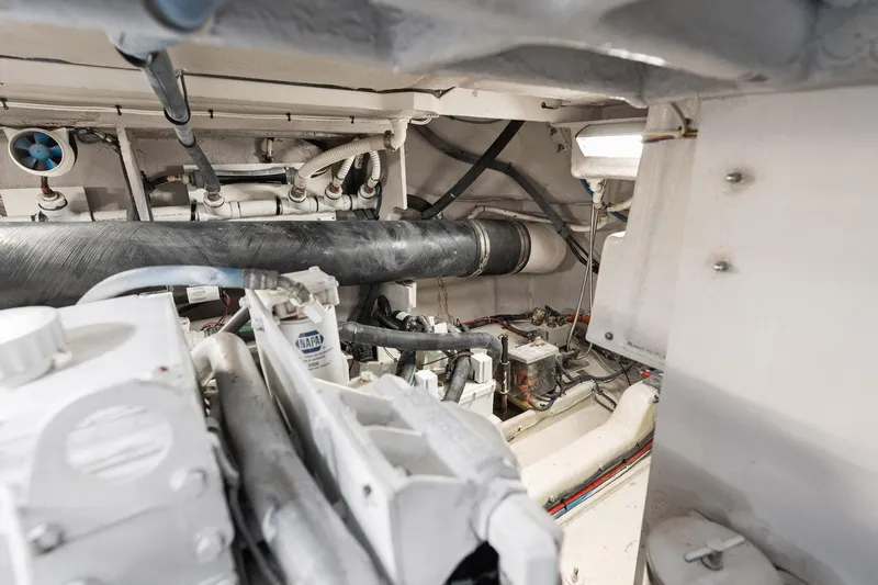 Guilty Pleasure Yacht Photos Pics Engine room of 2014 Sea Ray 510 Fly yacht, showcasing mechanical components and piping.