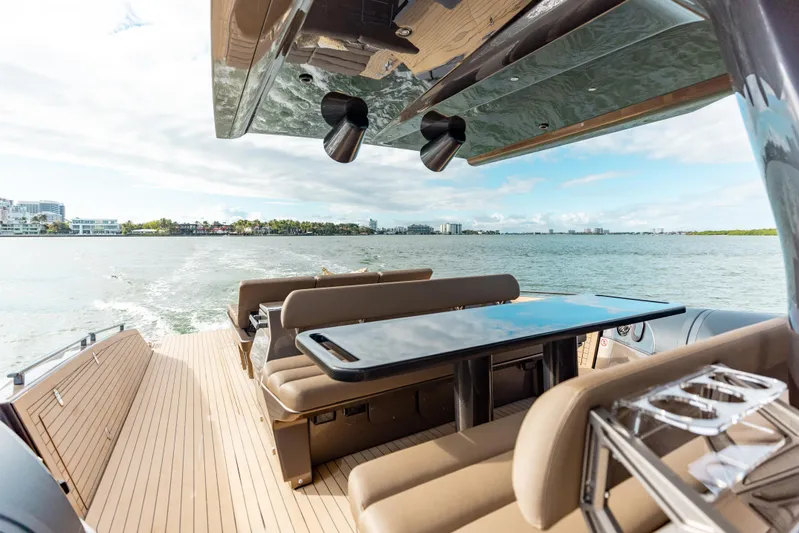 Anvera 48 Yacht Photos Pics Luxury Anvera 48 yacht deck with seating and table, cruising on open water, 2025 model.