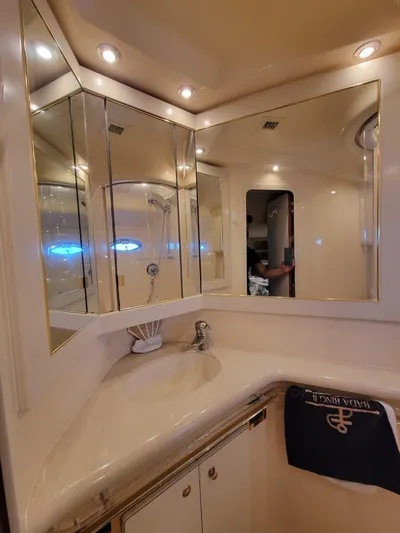 Bada Bing II Yacht Photos Pics Luxurious bathroom on a 2000 Sea Ray 540 Sundancer yacht with mirrored cabinets.