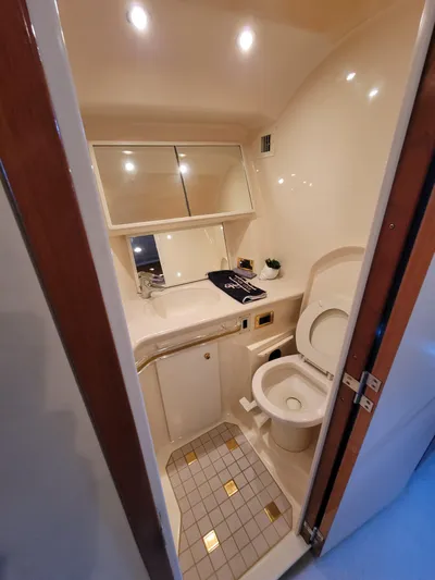 Bada Bing II Yacht Photos Pics Bathroom interior of 2000 Sea Ray 540 Sundancer yacht with toilet and sink.