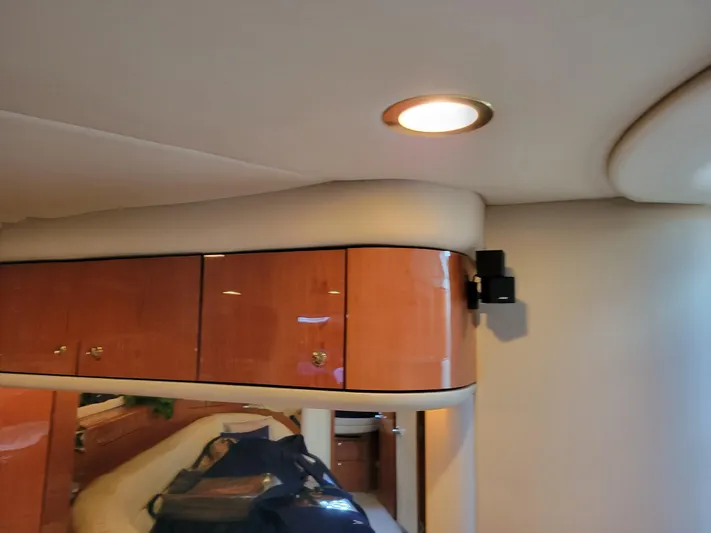 Bada Bing II Yacht Photos Pics 2000 Sea Ray 540 Sundancer interior with wooden cabinets and recessed lighting.