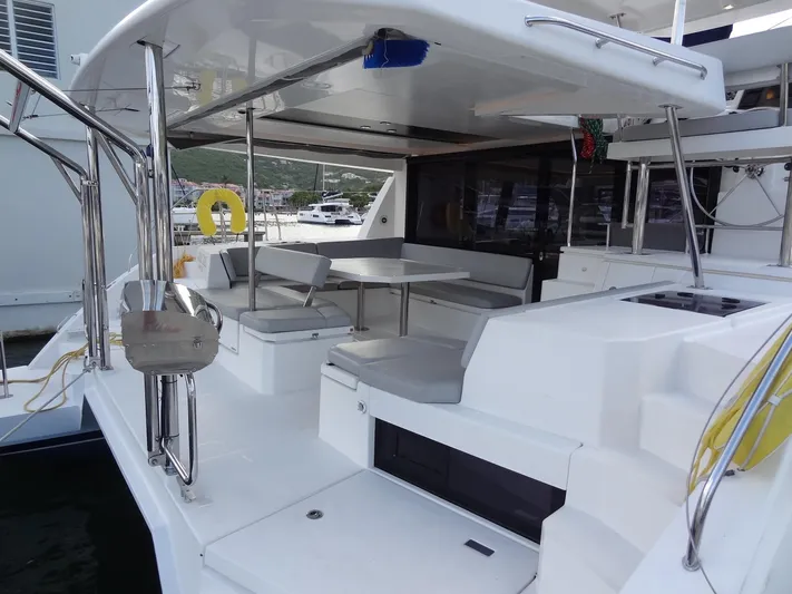 Good Times Yacht Photos Pics Leopard 45 catamaran's spacious deck with seating and dining area, 2020 model.