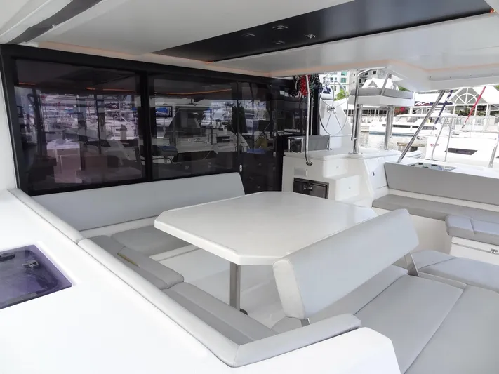 Good Times Yacht Photos Pics Spacious seating area on a 2020 Leopard 45 catamaran, featuring modern design and ample comfort.