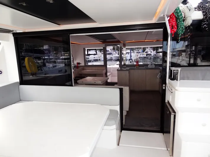 Good Times Yacht Photos Pics Interior view of a 2020 Leopard 45 catamaran, showcasing modern seating and dining area.