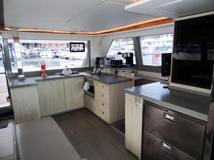 Good Times Yacht Photos Pics Modern kitchen interior on a 2020 Leopard 45 yacht, featuring sleek countertops and appliances.
