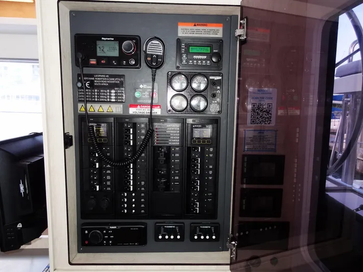 Good Times Yacht Photos Pics Electrical control panel on a 2020 Leopard 45 yacht, featuring various switches and gauges.