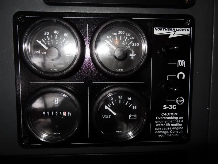 Good Times Yacht Photos Pics Control panel of a 2020 Leopard 45 with gauges and caution label.
