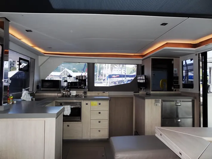 Good Times Yacht Photos Pics Modern kitchen interior of 2020 Leopard 45 yacht with sleek cabinetry and appliances.