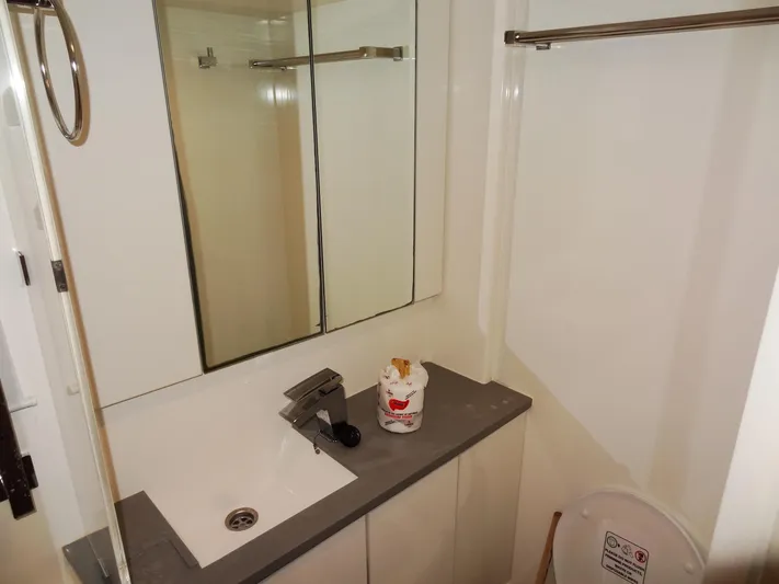 Good Times Yacht Photos Pics Modern bathroom in 2020 Leopard 45 yacht with sink, mirror, and toilet.