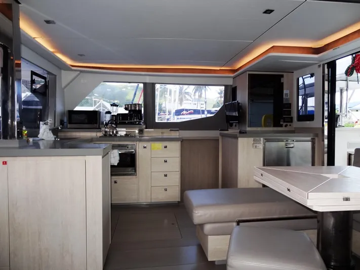 Good Times Yacht Photos Pics Modern kitchen interior of 2020 Leopard 45 catamaran with sleek design and appliances.