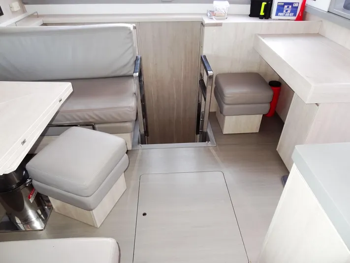 Good Times Yacht Photos Pics Modern interior of a 2020 Leopard 45 yacht with seating and storage.