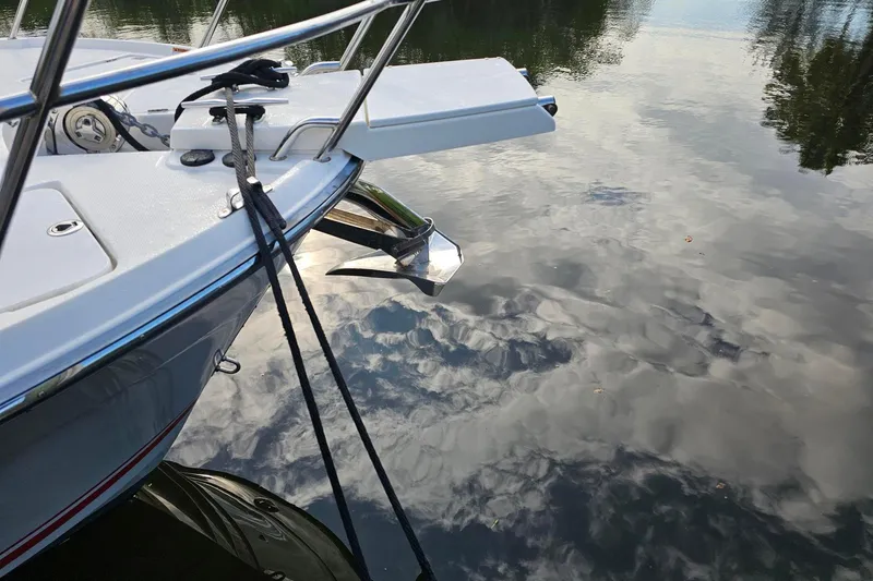 Frisky Yacht Photos Pics 2022 Cuwater C-32-CB boat anchored on calm reflective water.