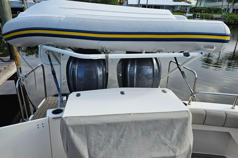 Frisky Yacht Photos Pics 2022 Cuwater C-32-CB boat with inflatable dinghy on davit system.