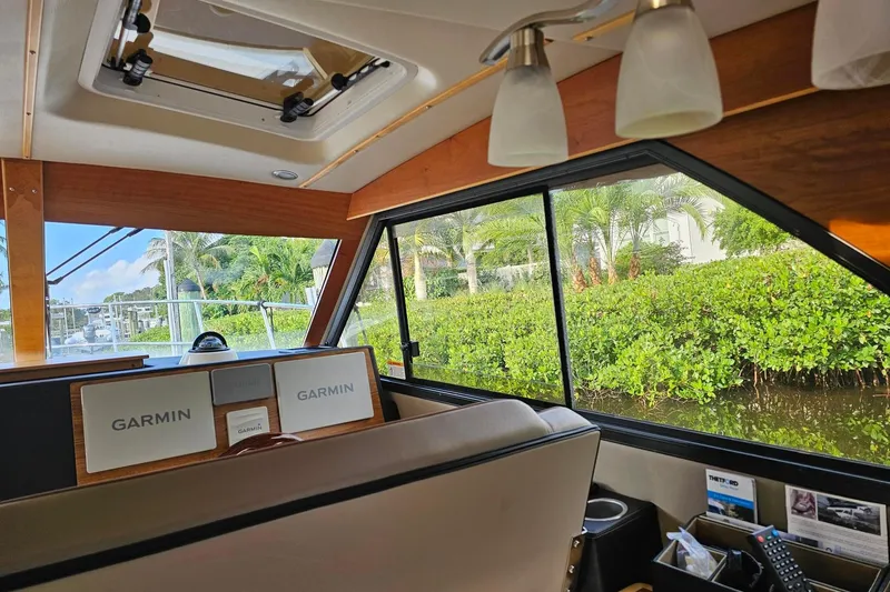 Frisky Yacht Photos Pics Interior of 2022 Cuwater C-32-CB boat with Garmin navigation system and scenic view.
