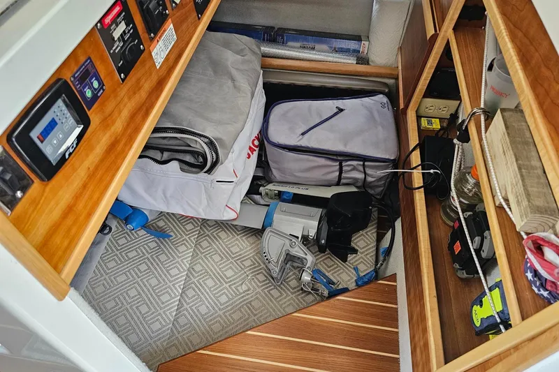 Frisky Yacht Photos Pics Storage area in a 2022 Cuwater C-32-CB boat with equipment and supplies.
