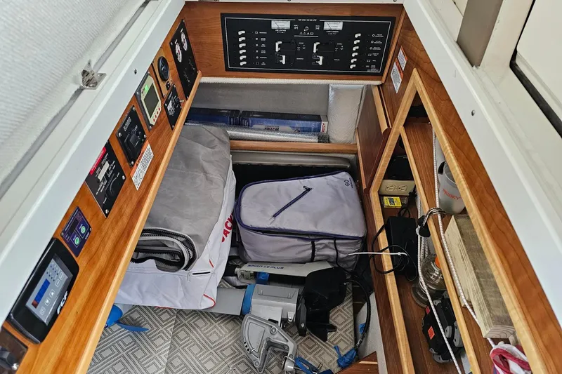 Frisky Yacht Photos Pics Interior of a 2022 Cuwater C-32-CB boat with storage and control panels.