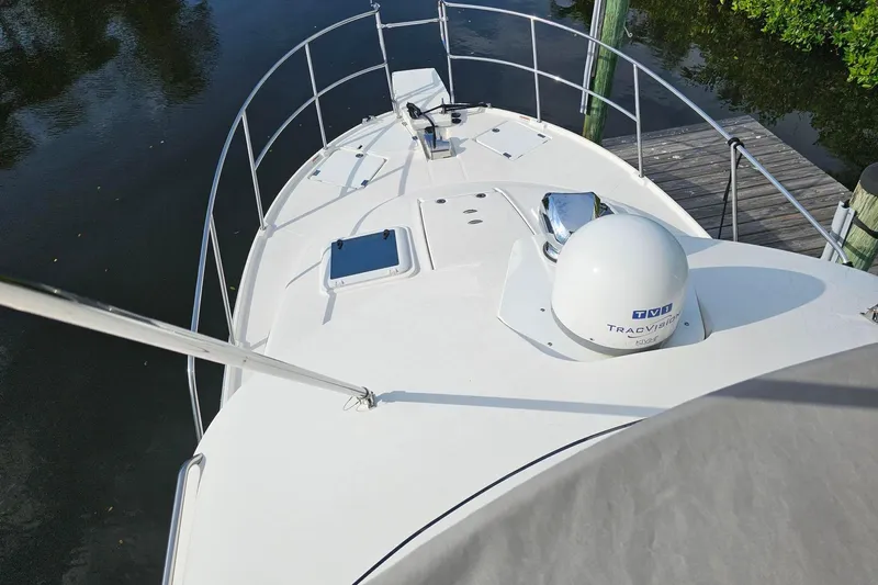 Frisky Yacht Photos Pics 2022 Cuwater C-32-CB boat deck with railing and satellite dome.
