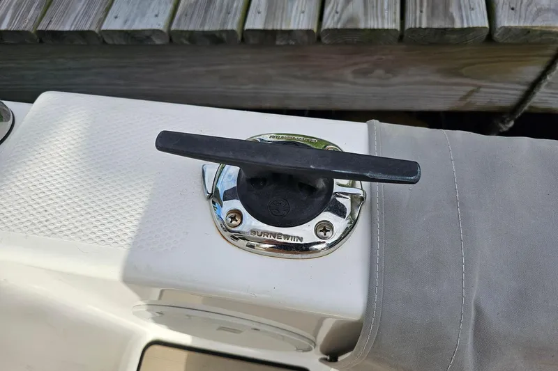 Frisky Yacht Photos Pics Boat cleat on a 2022 Cuwater C-32-CB, secured with a gray cover.