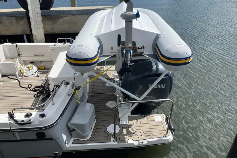 Frisky Yacht Photos Pics Inflatable boat on Cuwater C-32-CB, 2022 model, docked with Yamaha engine.