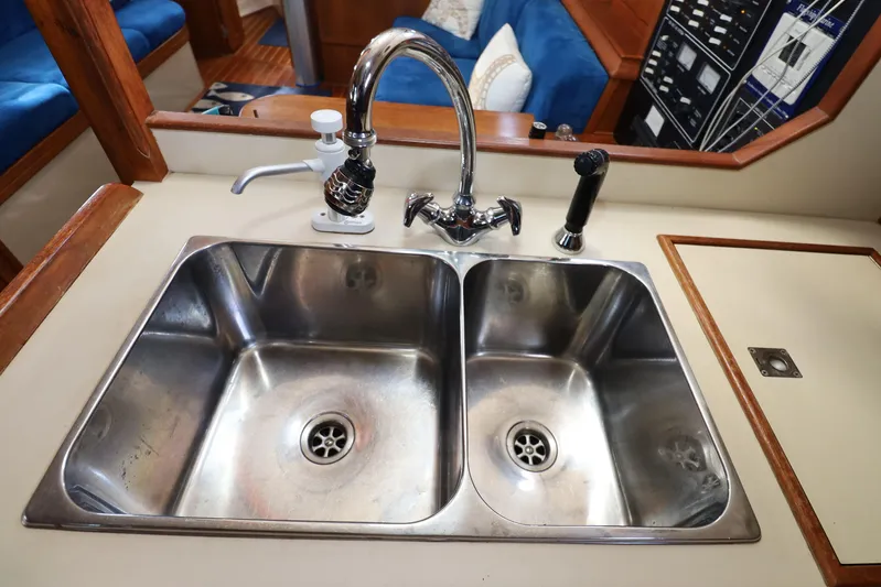 Migaloo Yacht Photos Pics Stainless steel double sink in 1996 Island Packet 40 yacht galley.