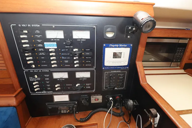 Migaloo Yacht Photos Pics Electrical control panel on a 1996 Island Packet 40 yacht, featuring AC and DC systems.