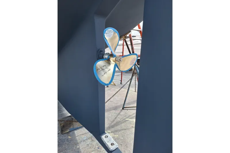 Migaloo Yacht Photos Pics Propeller of 1996 Island Packet 40 sailboat in dry dock.