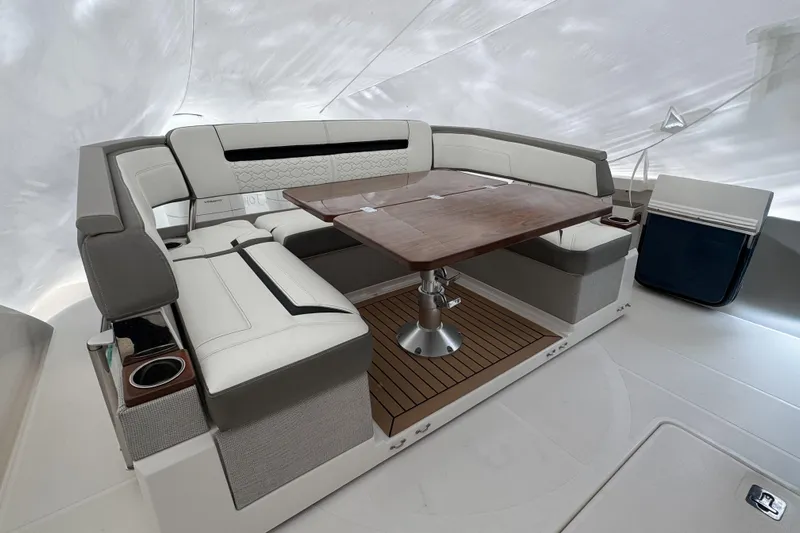  Yacht Photos Pics Luxurious seating area on 2022 Tiara Yachts 43 LS with elegant wood table.