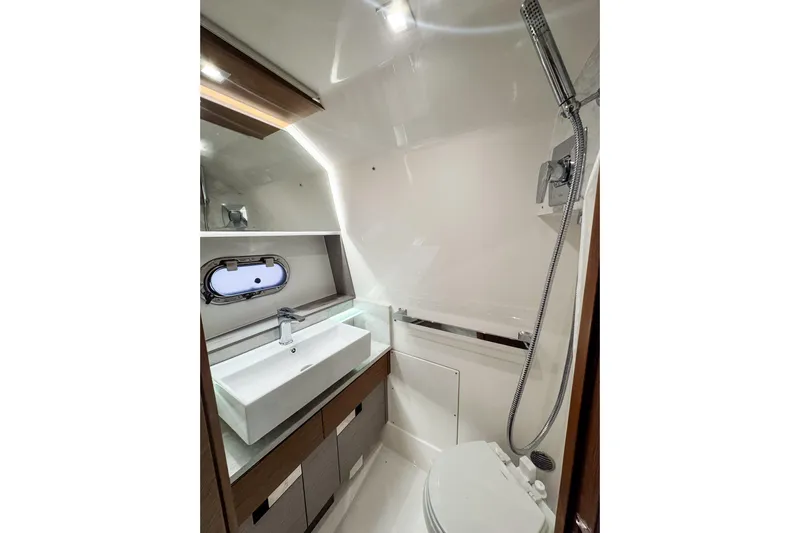  Yacht Photos Pics Luxurious 2022 Tiara Yachts 43 LS bathroom with modern fixtures and sleek design.