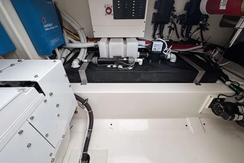  Yacht Photos Pics Engine compartment of 2022 Tiara Yachts 43 LS, showcasing mechanical components and wiring.