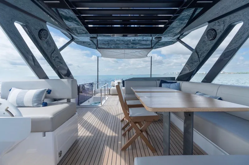 Santa Maria Yacht Photos Pics Luxurious 2024 Ferretti Yachts 720 deck with elegant seating and ocean view.