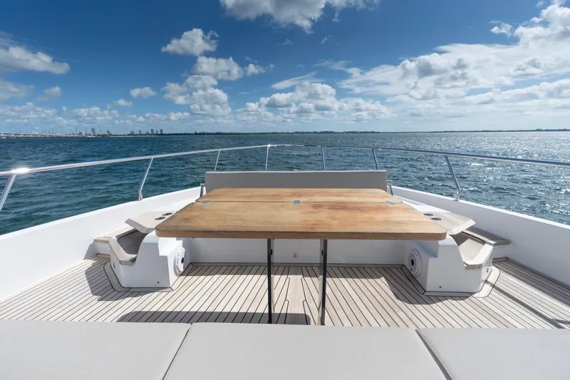 Santa Maria Yacht Photos Pics Luxurious 2024 Ferretti Yachts 720 deck with ocean view and elegant seating area.