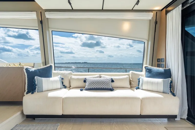 Santa Maria Yacht Photos Pics Luxurious interior of 2024 Ferretti Yachts 720 with ocean view through large windows.