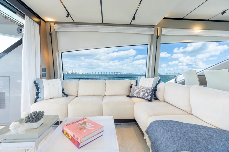 Santa Maria Yacht Photos Pics Luxurious interior of 2024 Ferretti Yachts 720 with ocean view through large windows.