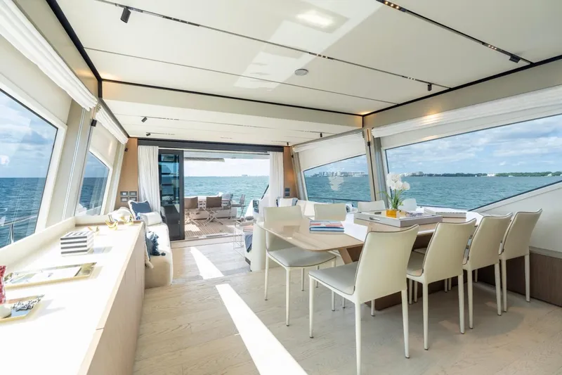 Santa Maria Yacht Photos Pics Luxurious interior of 2024 Ferretti Yachts 720 with ocean view and elegant dining area.
