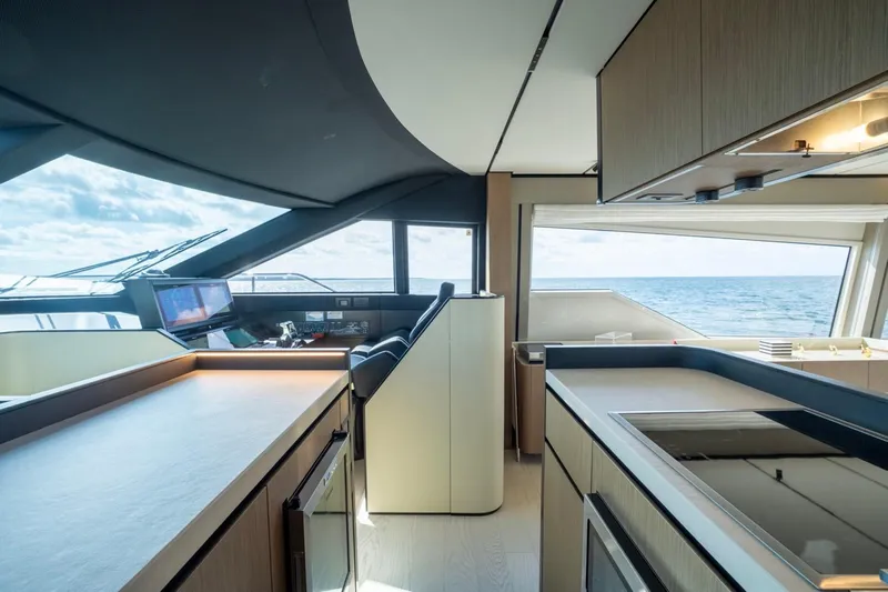Santa Maria Yacht Photos Pics Luxurious interior of 2024 Ferretti Yachts 720 with modern kitchen and ocean view.