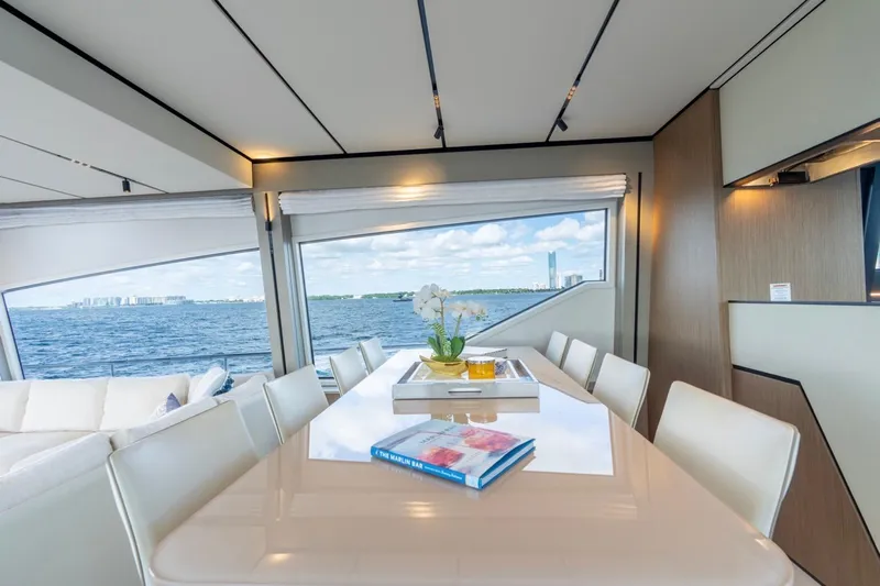 Santa Maria Yacht Photos Pics Luxurious interior of 2024 Ferretti Yachts 720 with ocean view and elegant dining area.