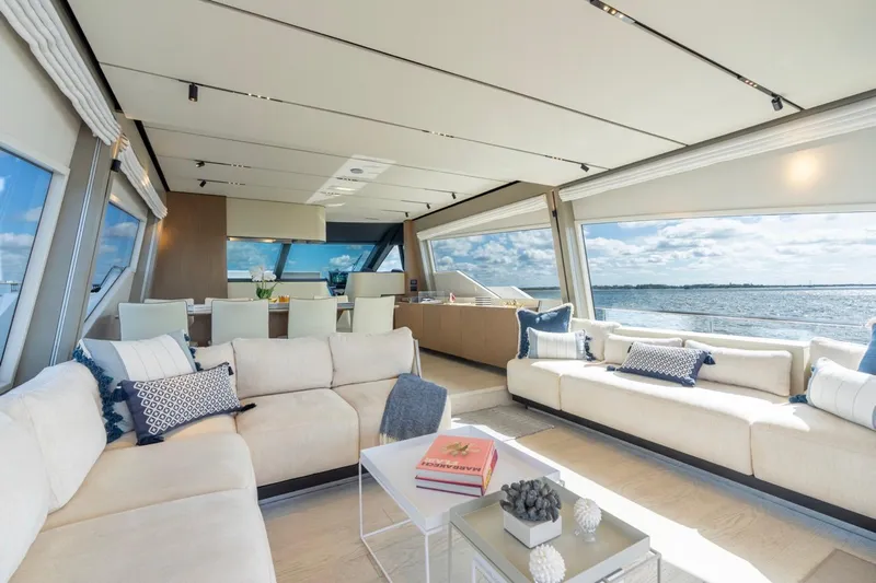 Santa Maria Yacht Photos Pics Luxurious interior of 2024 Ferretti Yachts 720 with elegant seating and ocean view.