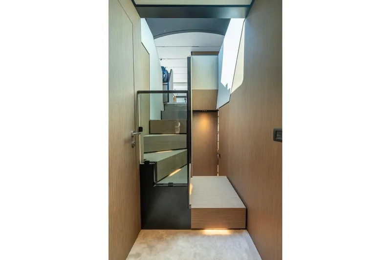 Santa Maria Yacht Photos Pics Interior staircase of 2024 Ferretti Yachts 720, featuring modern design and wood paneling.