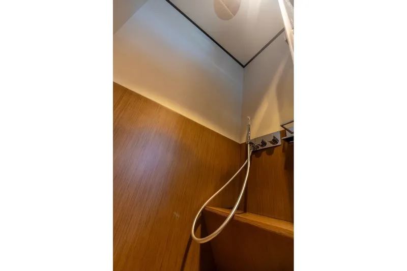 Santa Maria Yacht Photos Pics Shower area in 2024 Ferretti Yachts 720, featuring sleek wood paneling and modern fixtures.