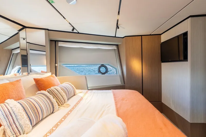 Santa Maria Yacht Photos Pics Luxurious bedroom interior of 2024 Ferretti Yachts 720 with ocean view.