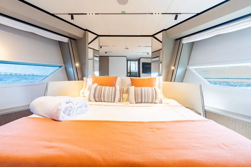 Santa Maria Yacht Photos Pics Luxurious bedroom interior of 2024 Ferretti Yachts 720 with ocean view windows.