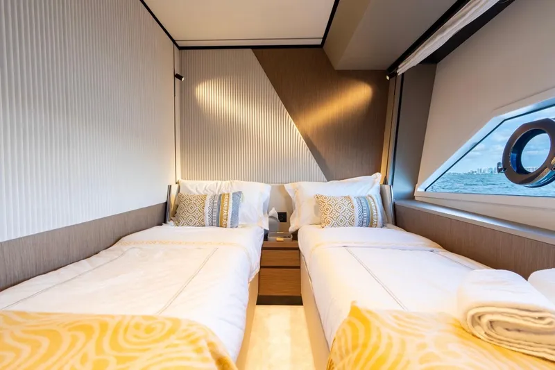 Santa Maria Yacht Photos Pics Luxurious twin bedroom on 2024 Ferretti Yachts 720 with ocean view.