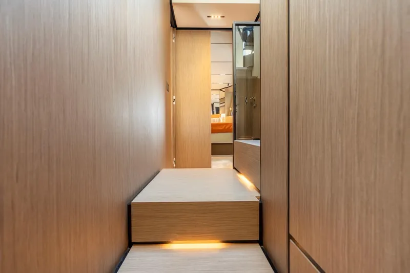 Santa Maria Yacht Photos Pics Luxurious interior hallway of 2024 Ferretti Yachts 720 with modern wood paneling.