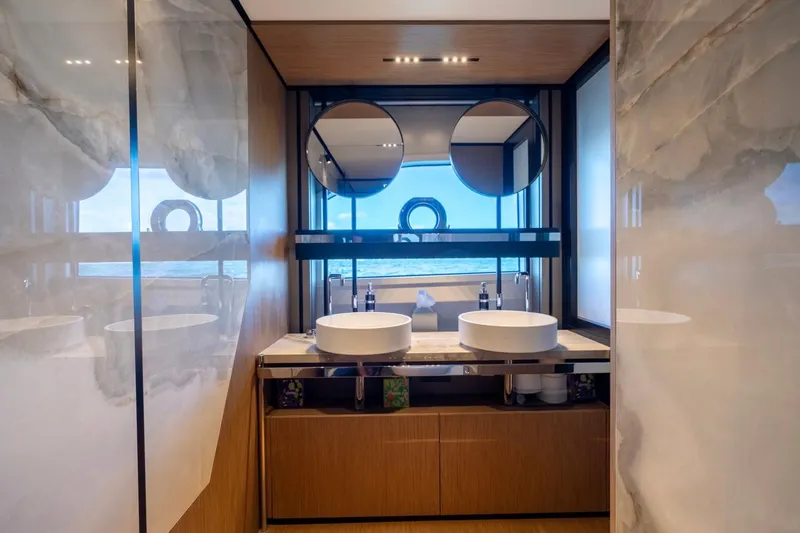 Santa Maria Yacht Photos Pics Luxurious bathroom interior on 2024 Ferretti Yachts 720 with dual sinks and ocean view.