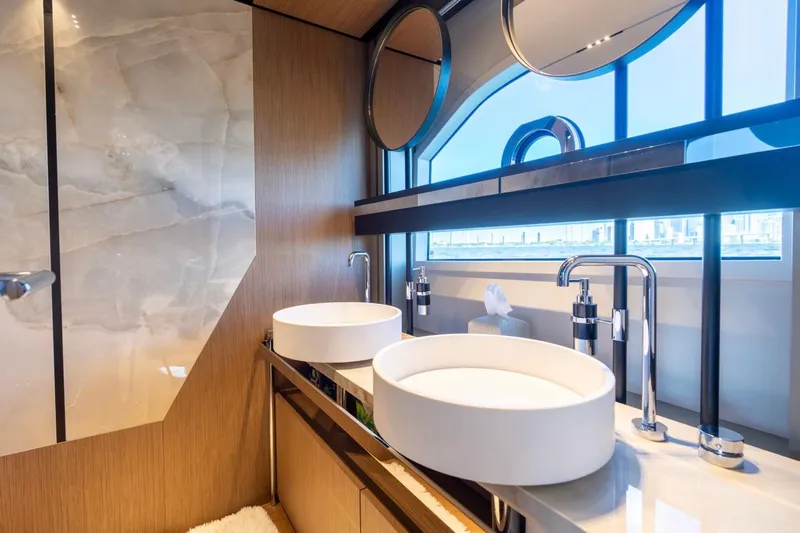 Santa Maria Yacht Photos Pics Luxurious bathroom interior of 2024 Ferretti Yachts 720 with dual sinks and modern fixtures.